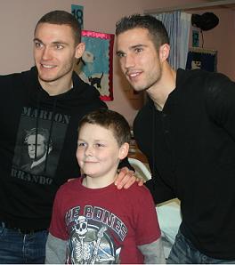 Darren kennedy, alongside Tomas Vermaelen and Robin van Persie 